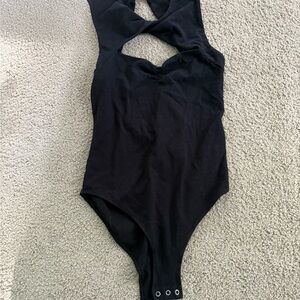 Peekaboo open back twist front snap bodysuit